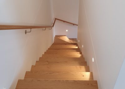 Lighting on a modern staircase by Quality Electrical Contracting.