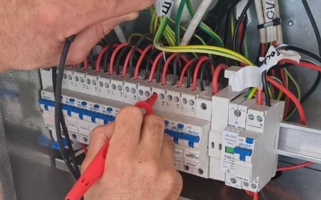 A photo showing Quality Electrical Contracting working on a switchboard upgrade